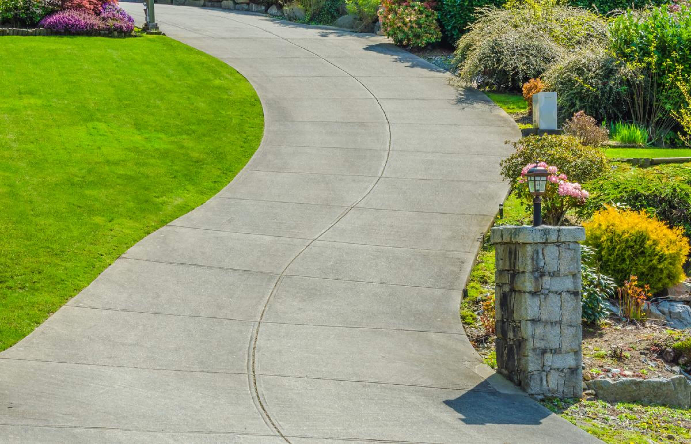 Beautifully maintained concrete driveway.