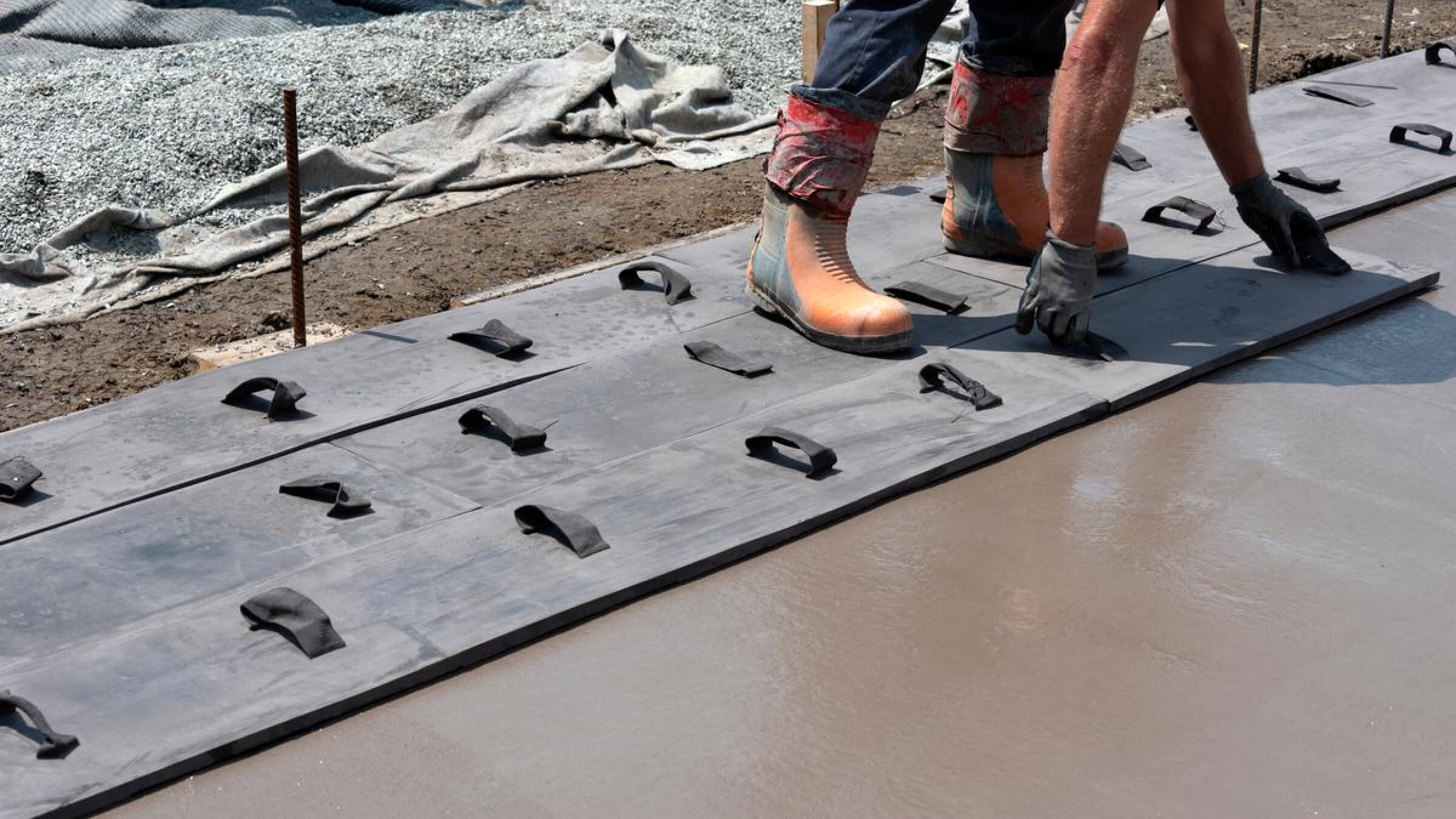 Concrete contractor stamping concrete.