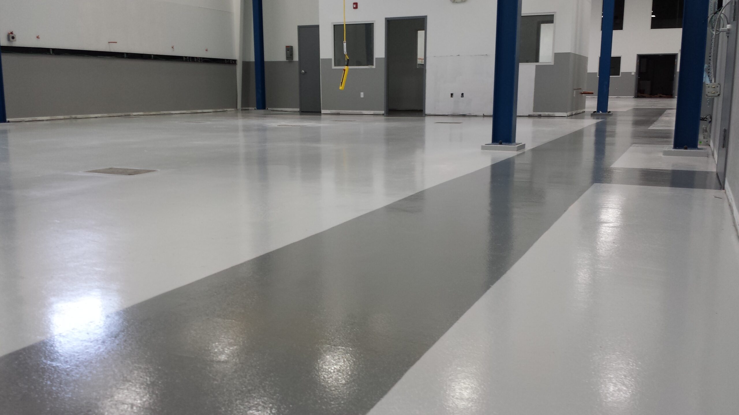 Clean concrete coating on interior of a gym.